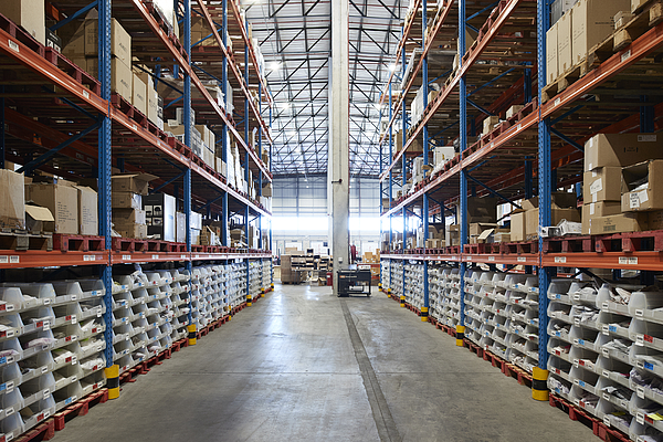 Aisles of shelved parts inventory in the MAG Global Parts warehouse